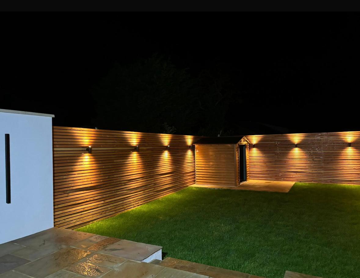 Garden wall lighting installation at night